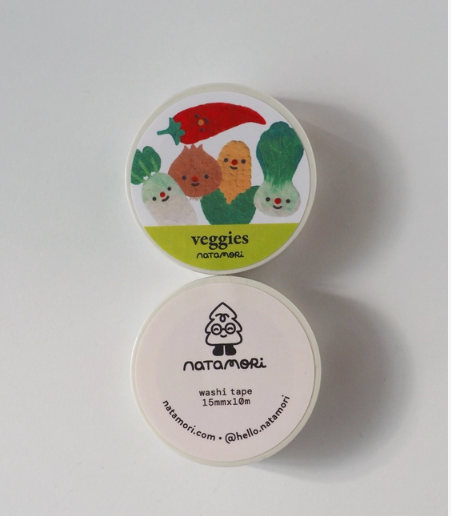 Two containers of washi tape with vegetable-themed design on the top lid.