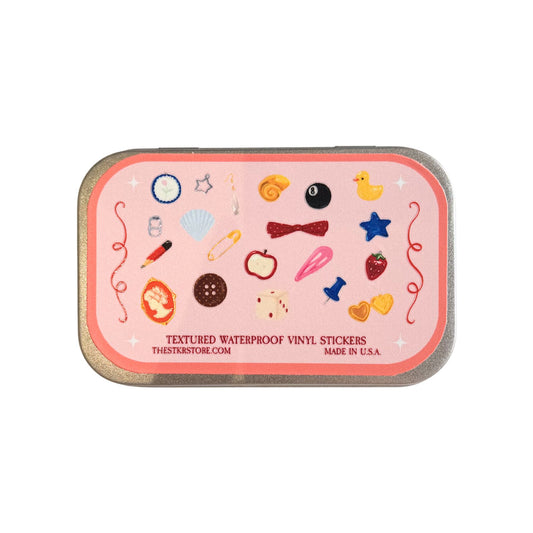 Pink container with textured waterproof vinyl stickers on a white background
