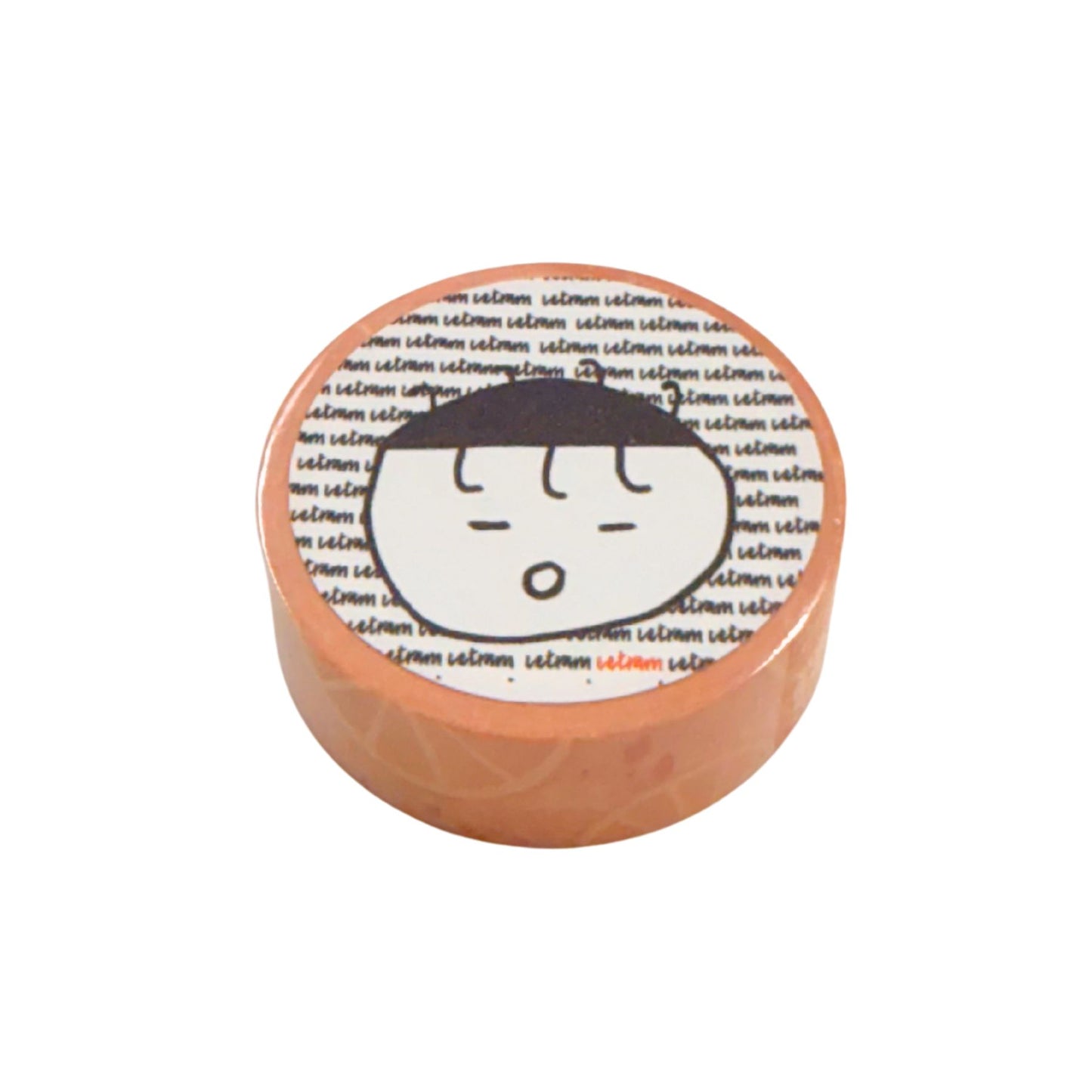 Round orange washi with a cartoon face design on a white background