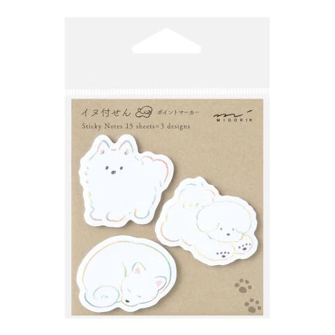 Pack of sticky notes with cat designs on a beige background