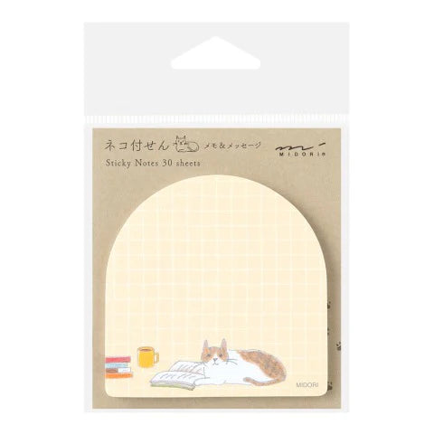 Sticky notes with a cat design on a beige background