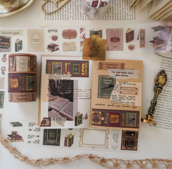 Sheet of decorative stickers with book-themed designs on a textured surface.