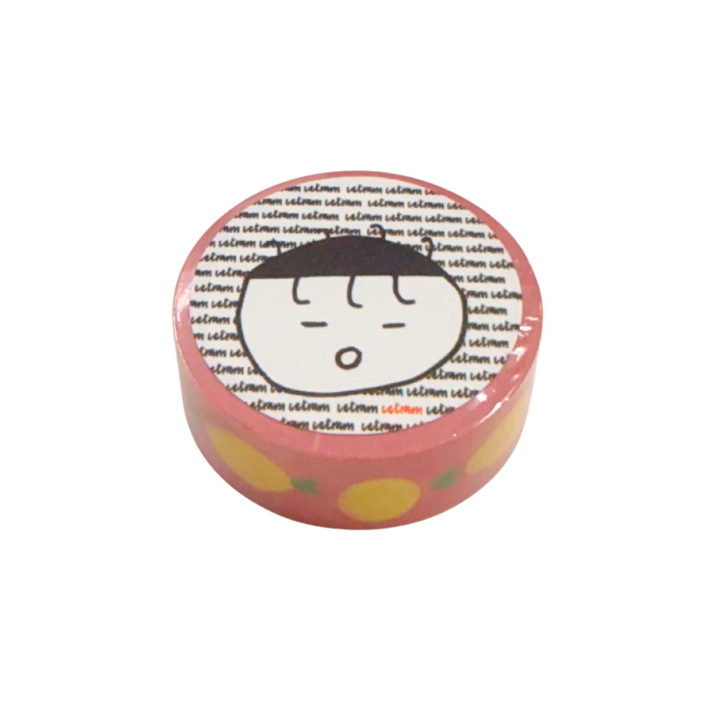 Round pink washi with cartoon face design on a white background