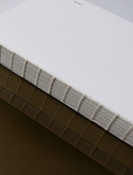 Close-up of a cardboard box with white top and brown bottom
