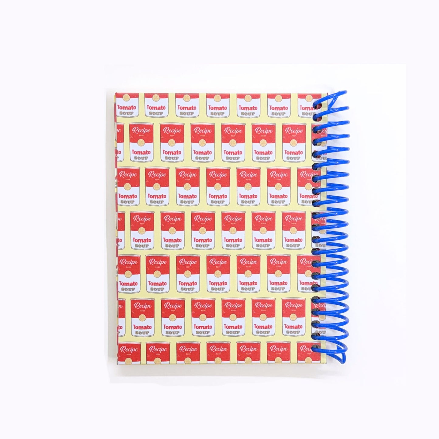 Notebook with tomato soup can pattern on cover