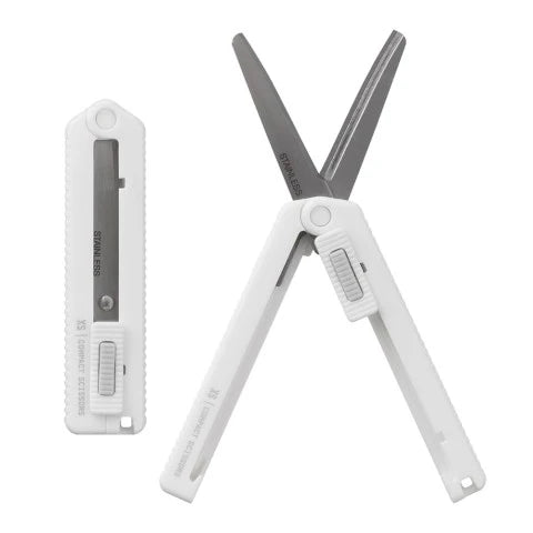 White folding scissors with a blade on a white background