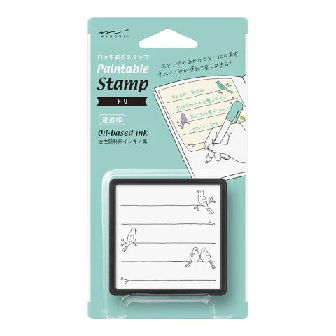 Paintable Stamp with illustration on packaging against a white background