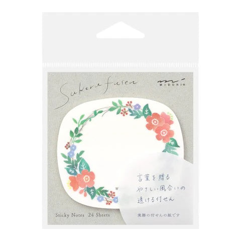 Pack of sticky notes with floral design on a white background