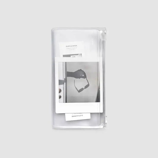 Clear plastic packaging with a black and white product image on a light gray background