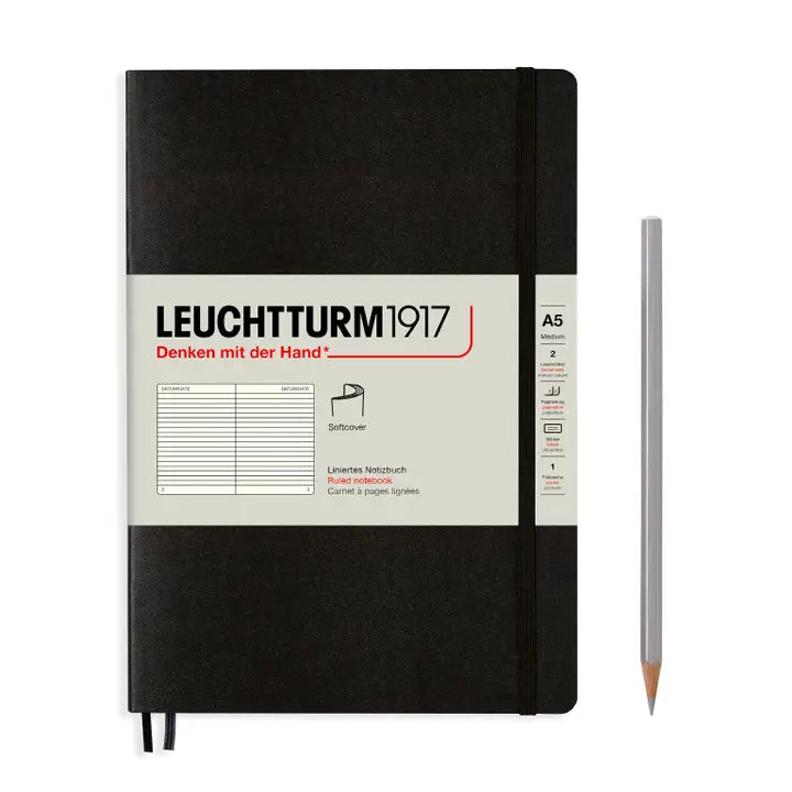 Black notebook with Leuchtturm1917 branding and a pencil on a white background