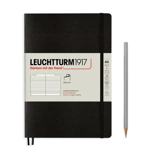 Black notebook with Leuchtturm1917 branding and a pencil on a white background