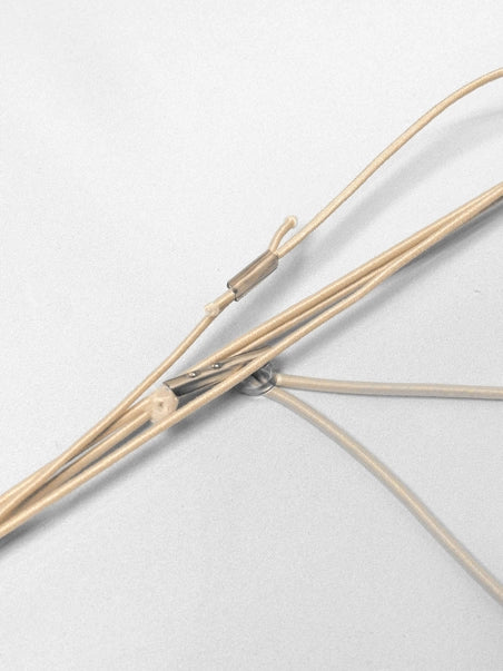 Close-up of a bow with string on a light gray background
