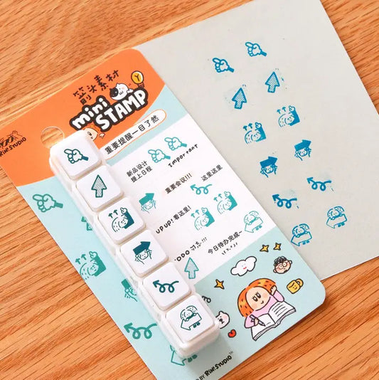 Set of mini stamps with a colorful packaging on a wooden surface