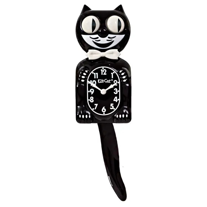Black cat-shaped clock with a white bow tie on a white background
