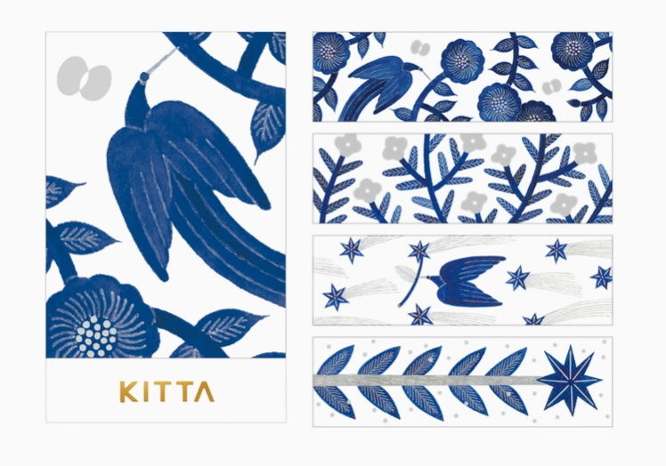 Collection of Kitta stationery items with blue and white designs on a white background