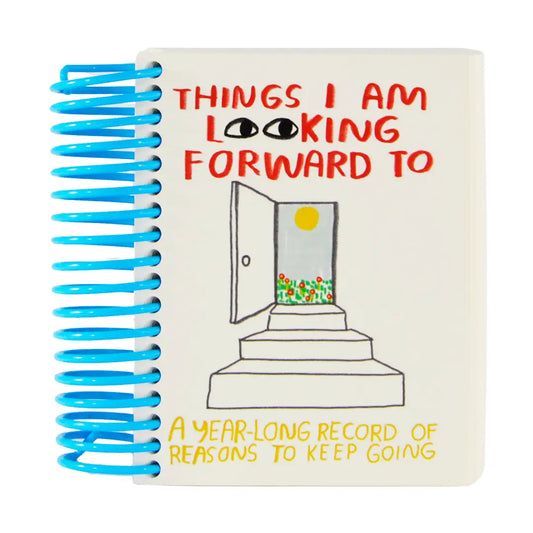 Notebook titled 'Things I Am Looking Forward To' with a door illustration on the cover.