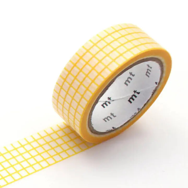 Yellow grid-patterned tape with 'mt' branding on a white background