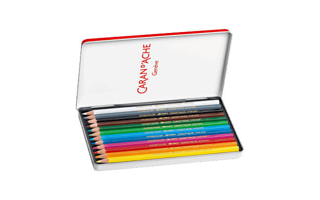 Set of colored pencils in a Caran d'Ache tin on a beige background