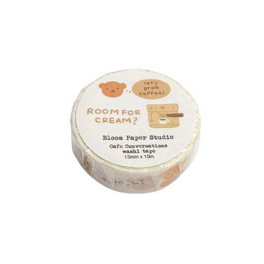 Round washi tape roll with text and graphics on a white background