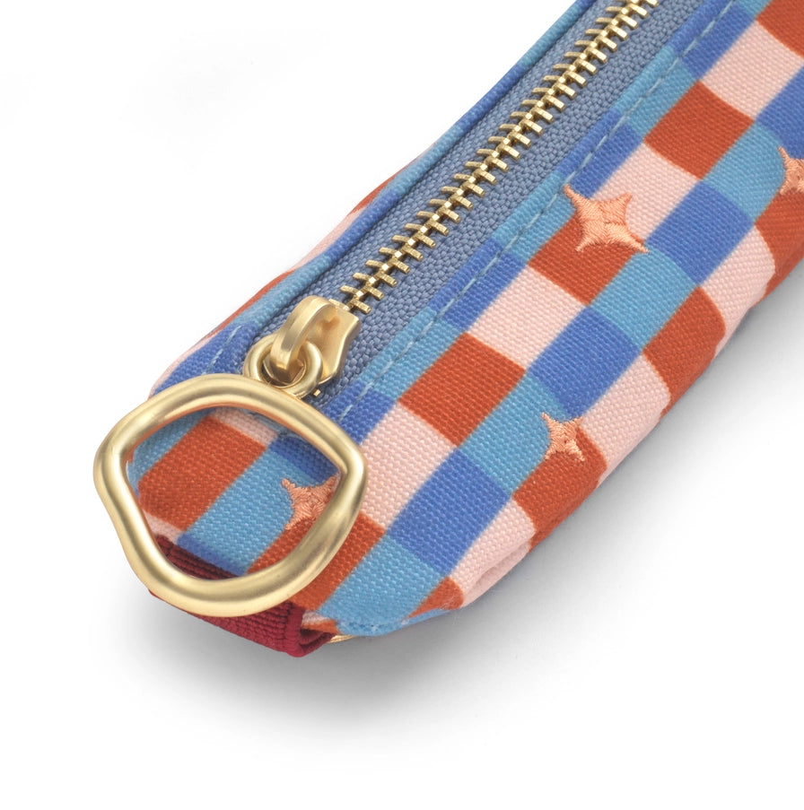 Colorful checkered pouch with gold zipper and clasp on a white background