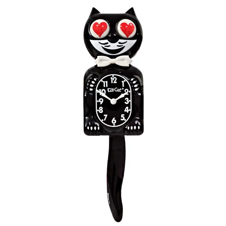 Black cat-shaped clock with red heart eyes on a white background