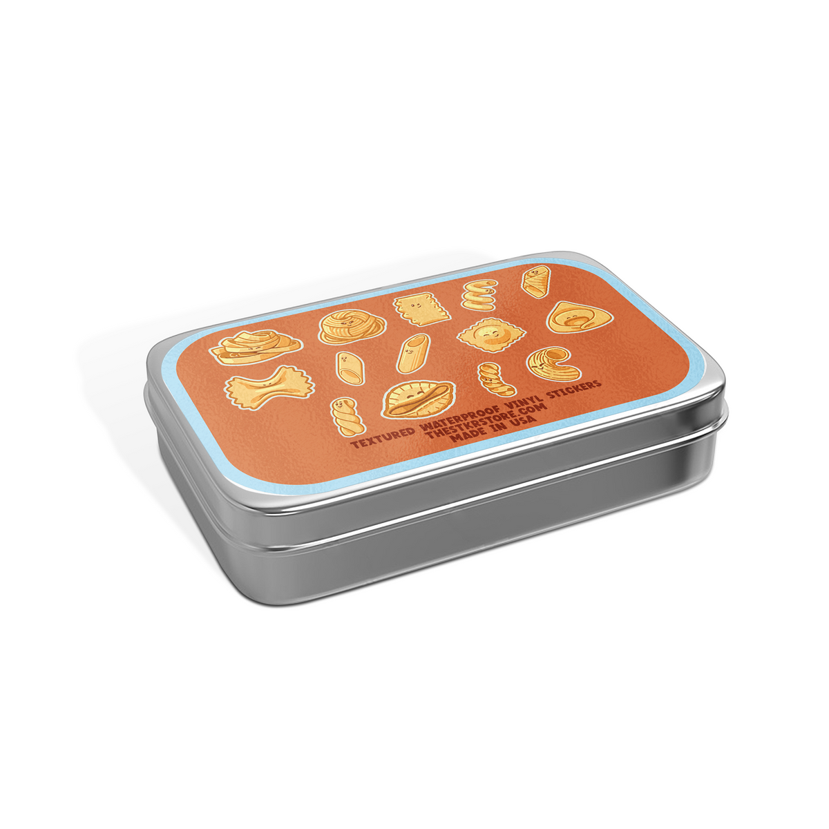 A rectangular metal tin with rounded corners, featuring a bright orange lid decorated with yellow illustrations of pasta shapes and the text 'FITTED BAKEWARE PIZZA TOAST SUSHI STUFFING STRETCHERS MADE IN USA'. The tin has a brushed silver-gray metallic body and sits on a clean white background with a soft shadow.