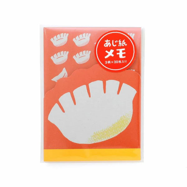 Notebook with fan-shaped pages on an orange cover