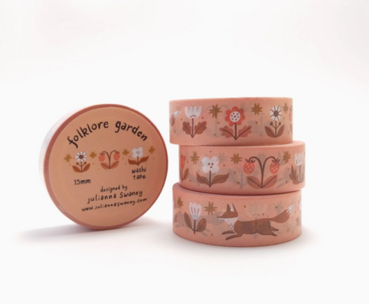 Set of three pink washi tape rolls with nature-themed designs on a white background