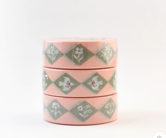 Two pink containers with green geometric pattern on a white background