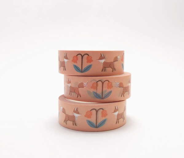 Set of three pink containers with fox and flower designs on a white background