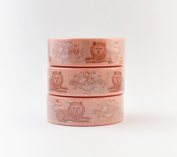 Set of three pink washi tape rolls with animal and floral designs on a white background