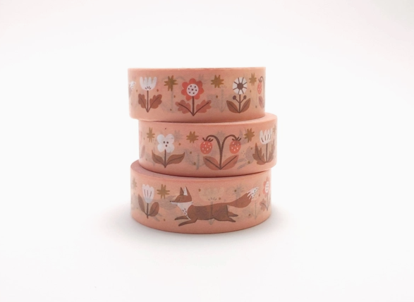 Set of three washi tape rolls with animal and floral patterns on a white background