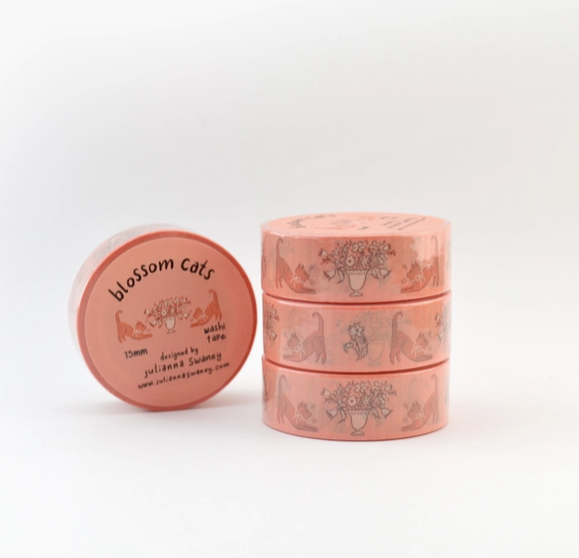 Set of pink containers with 'Blossom Cats' branding on a white background