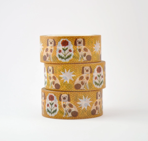Three rolls of decorative tape with dog and flower pattern on a white background