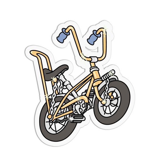 A die-cut vinyl sticker of a stylized BMX bicycle with a gold frame, black tires and seat, and blue handlebar grips, shown on a plain white background.