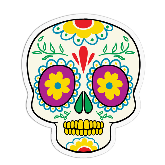 A die-cut sticker featuring a colorful sugar skull design on a white background. The skull has purple flower-shaped eye sockets with yellow centers, blue decorative patterns, green leaves, and yellow teeth.