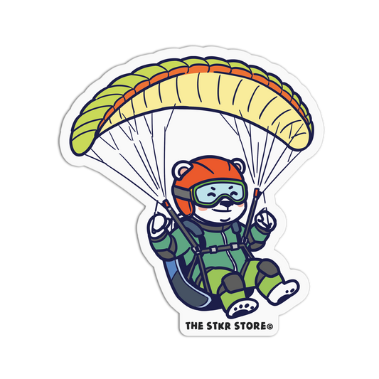 Sticker of a bear paragliding with a colorful parachute, branded 'The Star Store'.