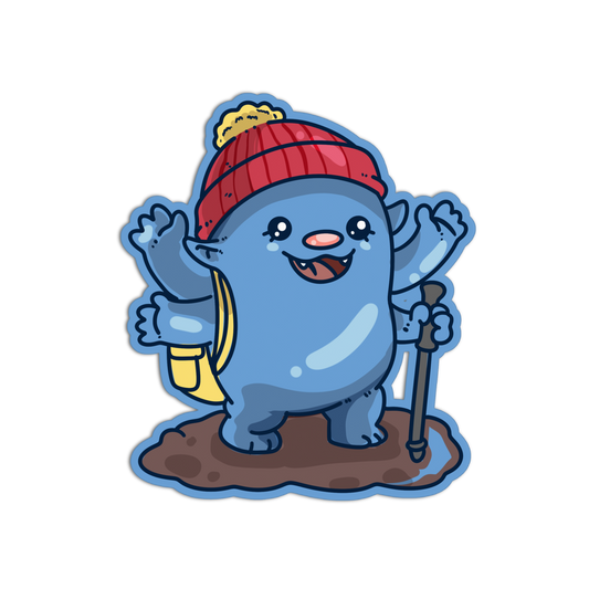 A cartoon blue creature sticker or decal wearing a red knit beanie with a yellow pom-pom, holding a hiking stick and smiling with raised paws, shown on a plain white background.