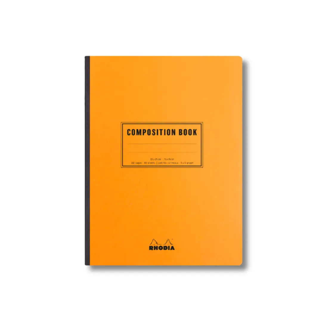 Orange composition book with black binding on a white background