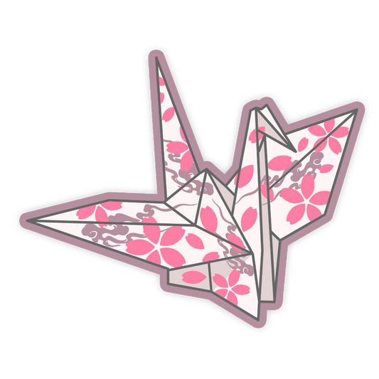 Origami crane with pink floral pattern on a white background