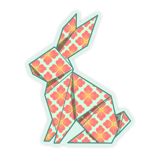 Origami rabbit with pink floral pattern on a white background