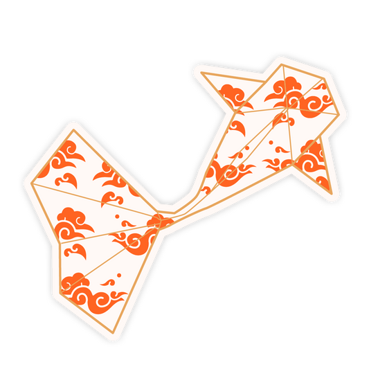 Decorative kite with orange patterns on a white background