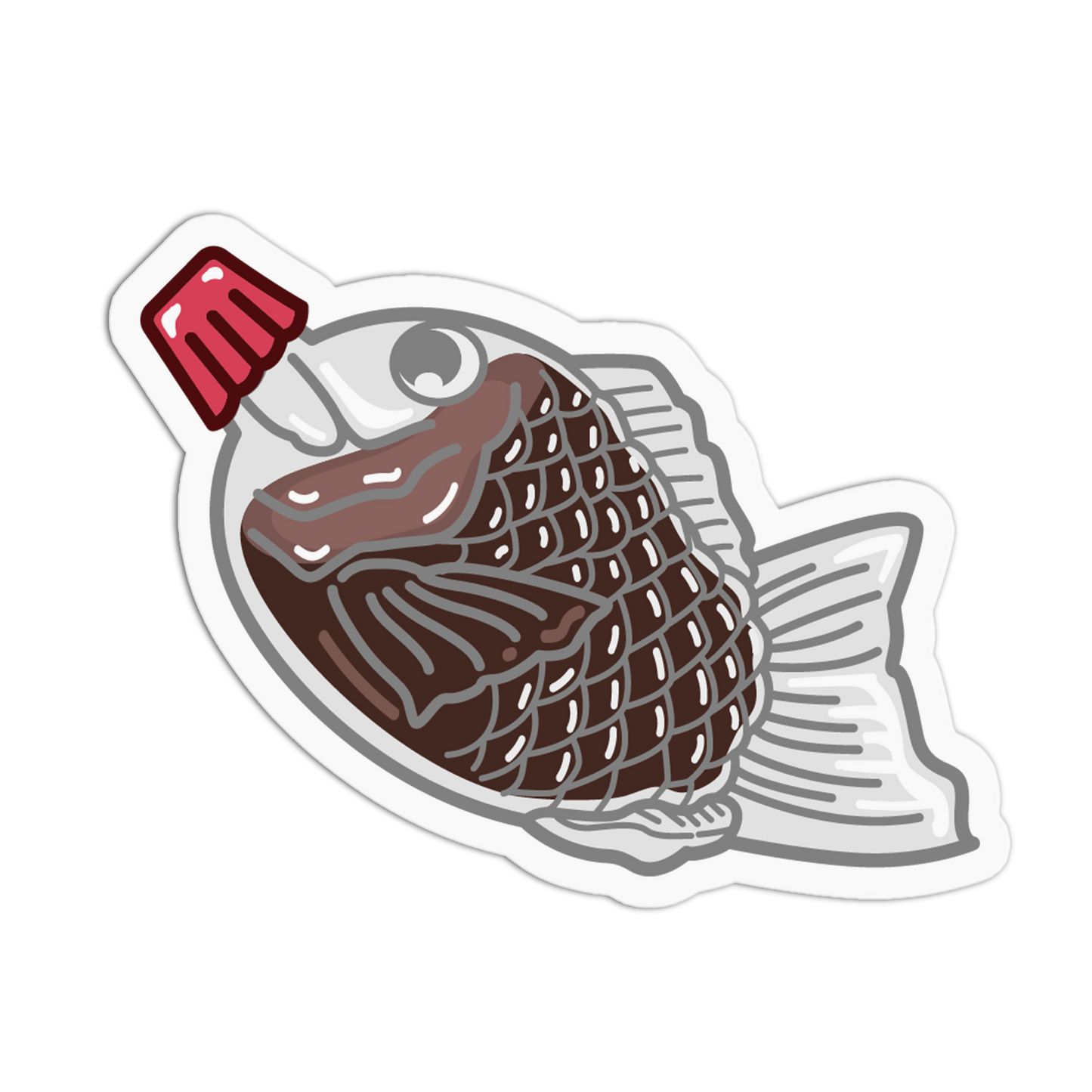 Sticker of a fish with a red m&m on a white background