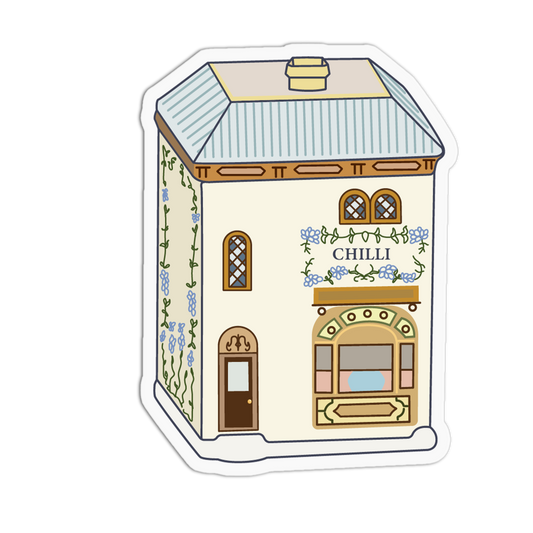 A die-cut sticker featuring a whimsical, hand-drawn illustration of a small building labeled 'CHILLI'. The building has a cream-colored facade, a light blue and white striped roof, brown trim, and blue floral details.