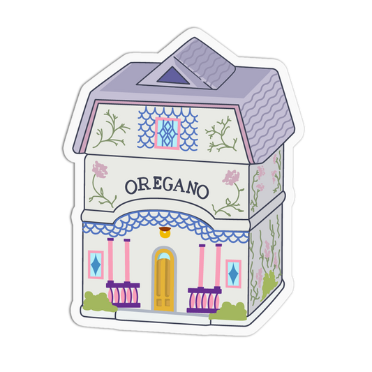 A die-cut sticker featuring a whimsical illustration of a house labeled 'OREGANO' on the front, with pastel purple, pink, blue, green, and yellow details, shown on a plain white background.