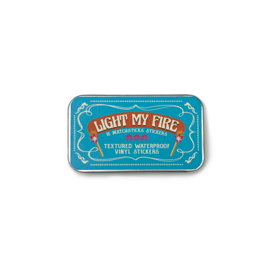 Matchbox-style packaging with 'Light My Fire' text on a white background