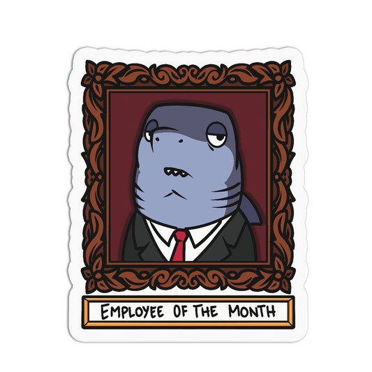A die-cut sticker featuring a cartoon shark dressed in a black suit and red tie, framed inside an ornate brown picture frame. Below the frame, a white banner reads 'EMPLOYEE OF THE MONTH'.