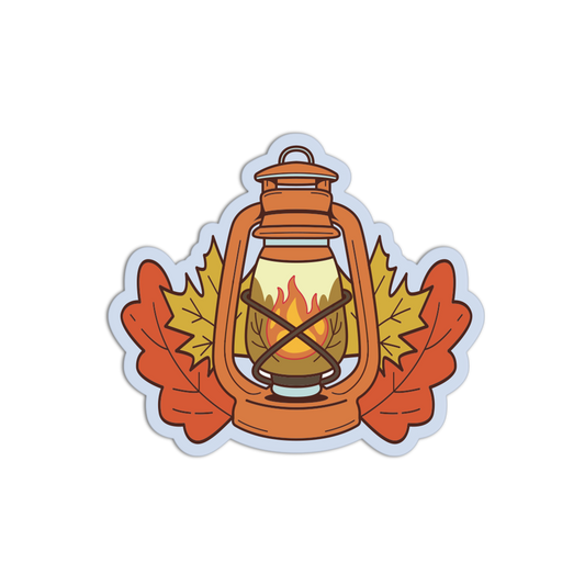 A die-cut sticker featuring an autumn-themed illustration of a vintage lantern with a lit flame, flanked by two orange maple leaves and a yellow leaf in the center, shown on a plain white background.