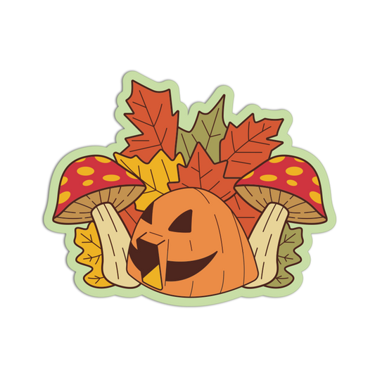 A die-cut sticker featuring a cartoon jack-o'-lantern surrounded by autumn leaves, mushrooms, and acorns on a white background.