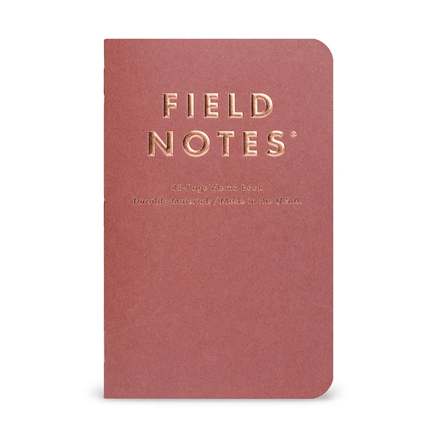Red notebook with 'Field Notes' branding on a white background